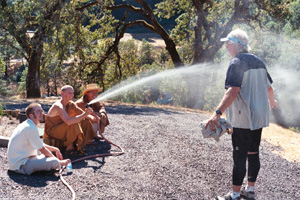 Monk Spraying Rider